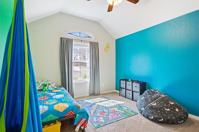 carpeted bedroom with vaulted ceiling, a ceiling fan, and baseboards