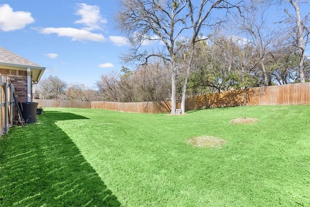 view of yard featuring a fenced backyard