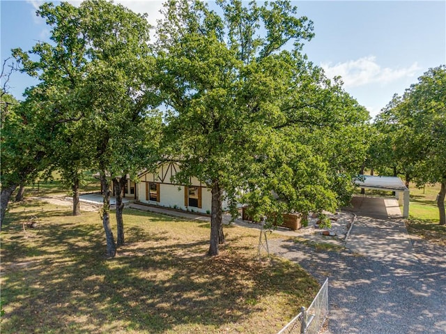 obstructed view of property featuring a carport