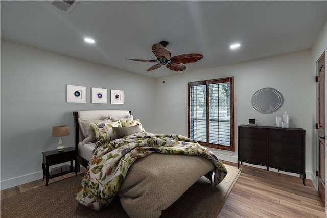 bedroom featuring ceiling fan and light hardwood / wood-style flooring