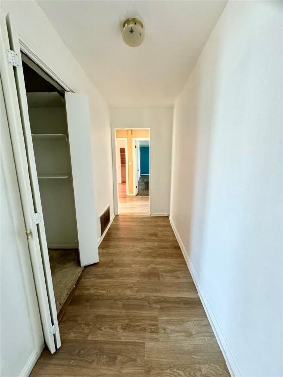 hallway featuring hardwood / wood-style flooring