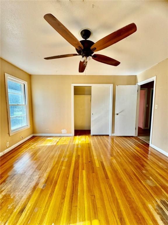 interior space featuring light wood-type flooring and ceiling fan