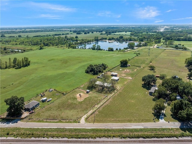 birds eye view of property with a water view and a rural view