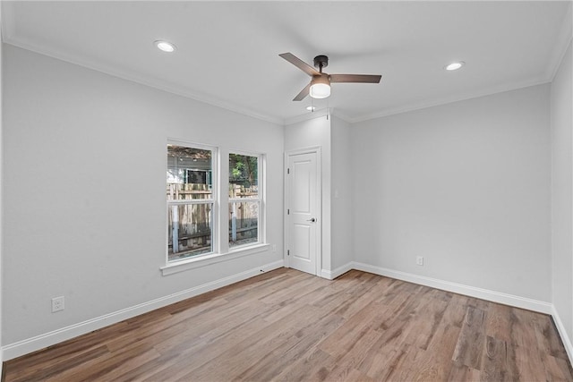 unfurnished room with ceiling fan, ornamental molding, and light hardwood / wood-style floors