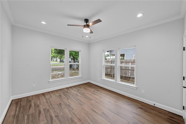 unfurnished room featuring wood-type flooring, ornamental molding, and ceiling fan