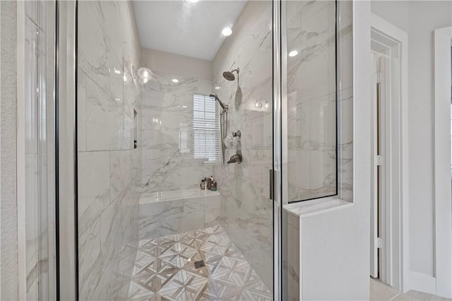 bathroom with a shower with door