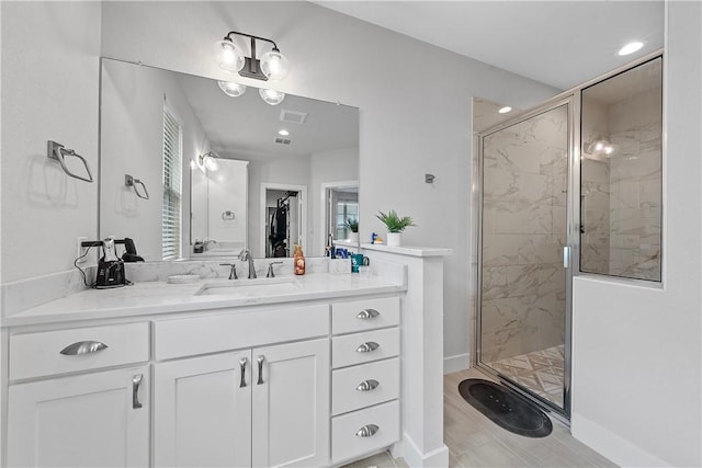 bathroom featuring vanity and walk in shower