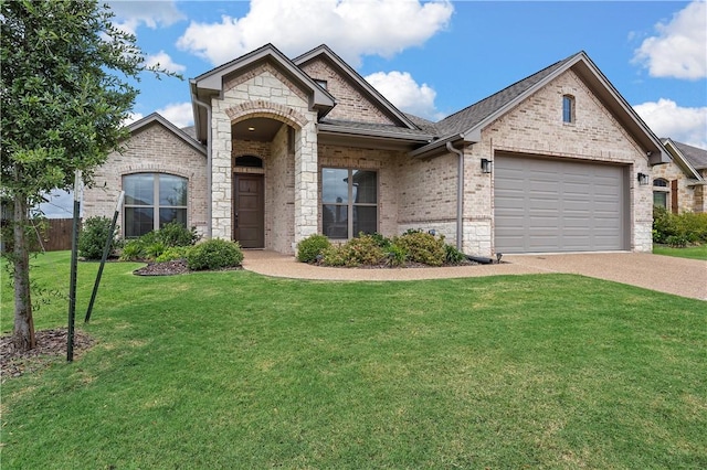 view of front facade with a front yard and a garage