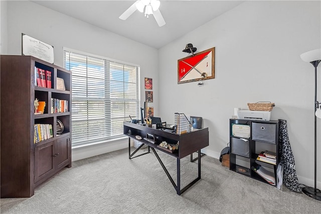 home office with light carpet and ceiling fan