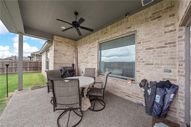 view of patio featuring ceiling fan