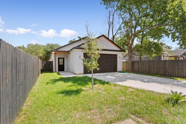 exterior space with a front yard and a garage