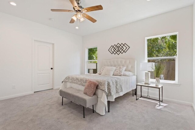 carpeted bedroom featuring ceiling fan