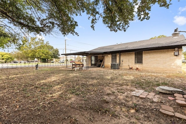 back of property featuring cooling unit