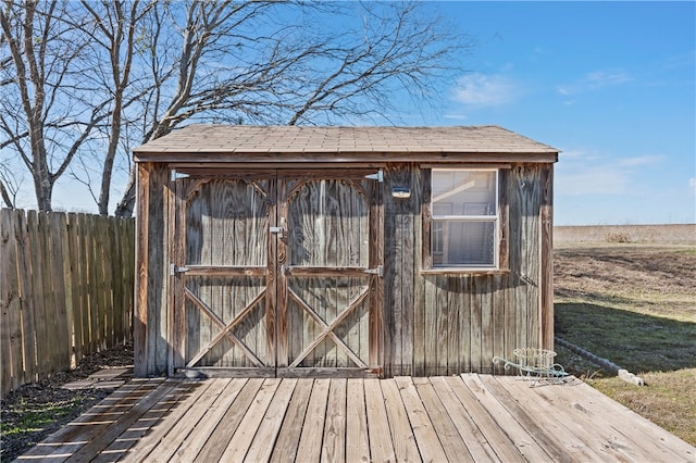 view of shed with fence