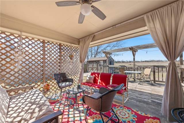 view of patio / terrace with an outdoor living space and a ceiling fan