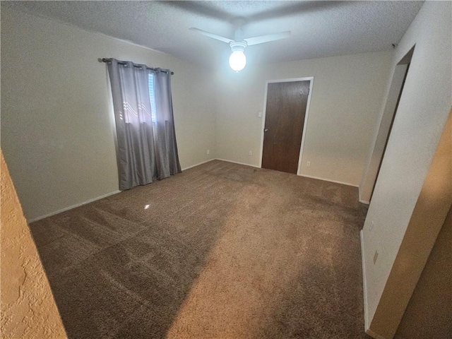 unfurnished room with carpet floors, a textured ceiling, and a ceiling fan