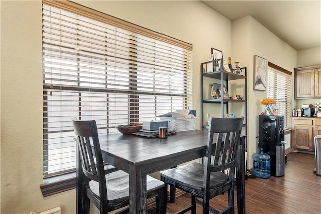 dining space with dark wood-type flooring