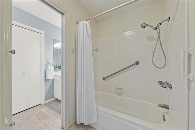 full bathroom with tile patterned floors and shower / bath combo with shower curtain