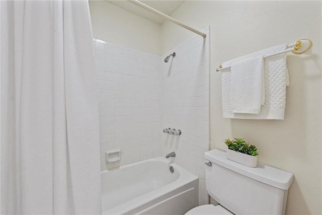 full bath featuring toilet and shower / bath combo with shower curtain