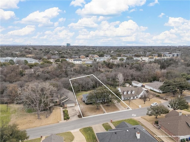 birds eye view of property with a residential view