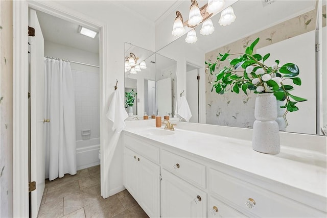 bathroom featuring a notable chandelier, shower / bath combo with shower curtain, ornamental molding, vanity, and tile patterned floors