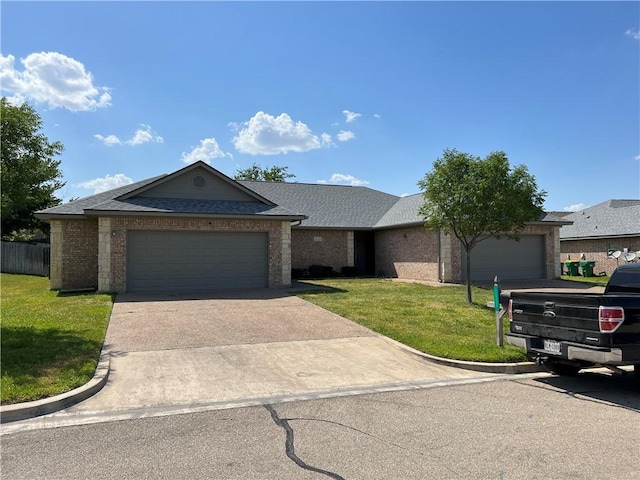 ranch-style home with a front lawn and a garage