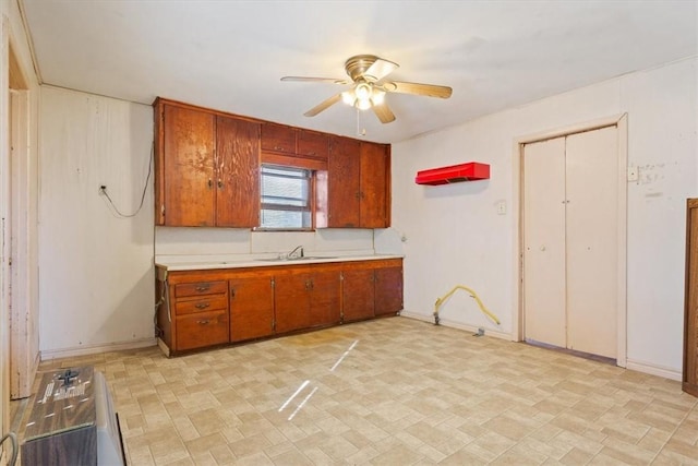 kitchen with ceiling fan and sink