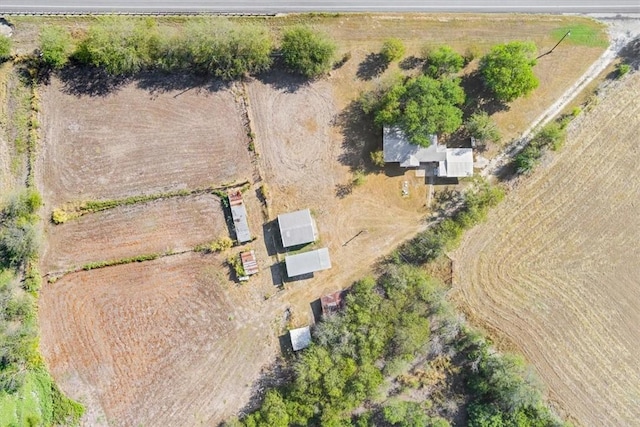 birds eye view of property with a rural view