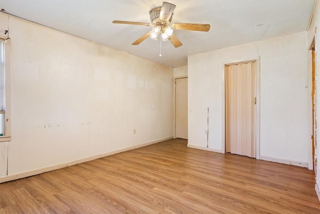 unfurnished bedroom featuring ceiling fan and light wood-type flooring