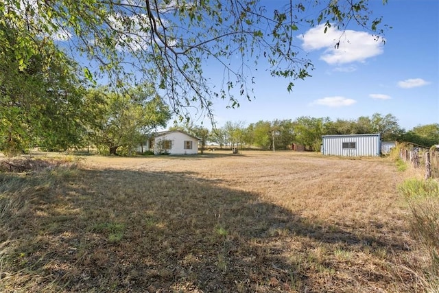 view of yard with an outbuilding