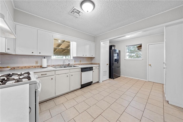 kitchen with a textured ceiling, white appliances, ventilation hood, sink, and white cabinets