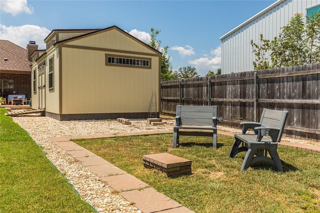 view of yard featuring an outdoor structure and fence