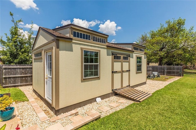 view of shed with a fenced backyard