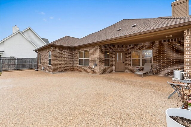 view of property's community featuring a fenced backyard and a lawn