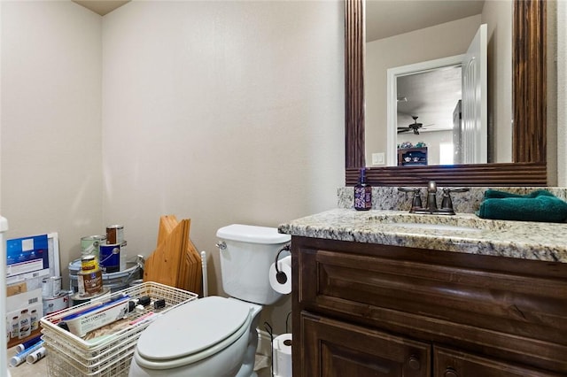 half bath featuring toilet and vanity