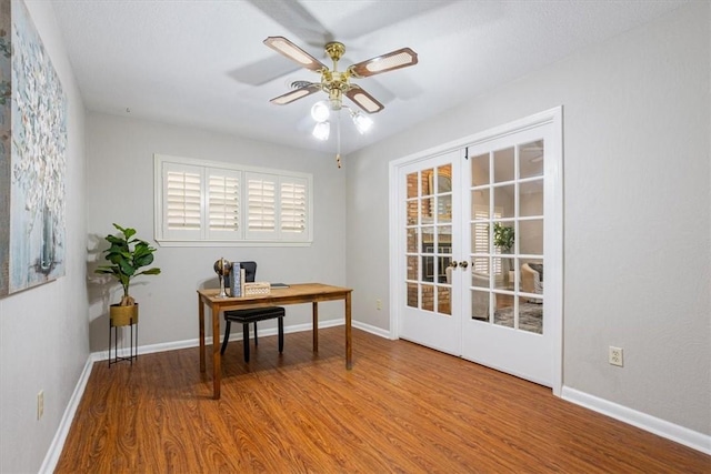 office with ceiling fan, french doors, and hardwood / wood-style floors