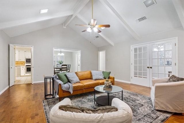 living room featuring ceiling fan with notable chandelier, french doors, beam ceiling, and dark hardwood / wood-style floors