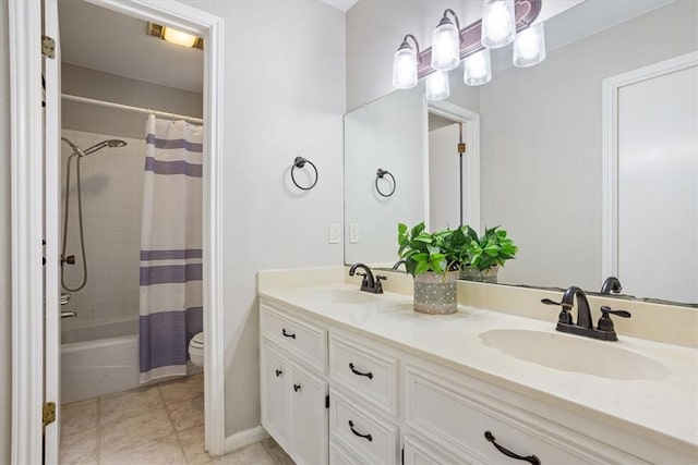 full bathroom featuring shower / tub combo with curtain, vanity, and toilet