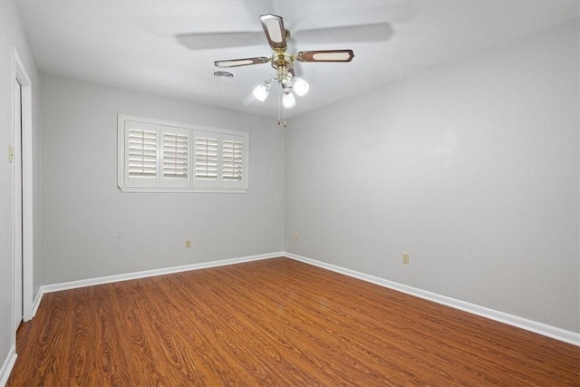 spare room featuring ceiling fan and hardwood / wood-style flooring