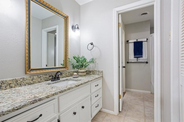 bathroom featuring tile patterned floors and vanity