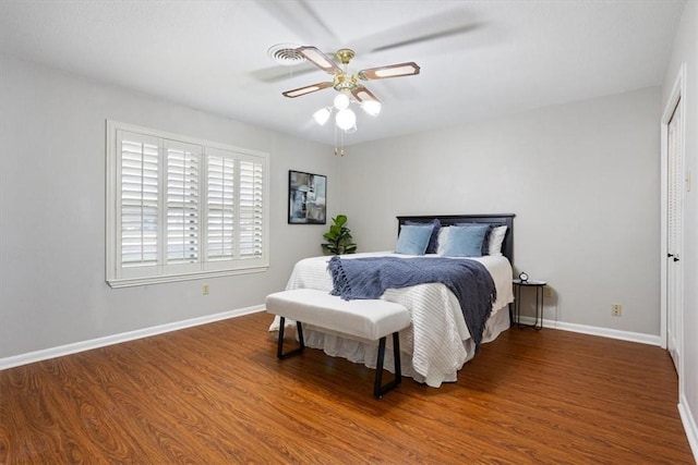 bedroom with ceiling fan and hardwood / wood-style flooring