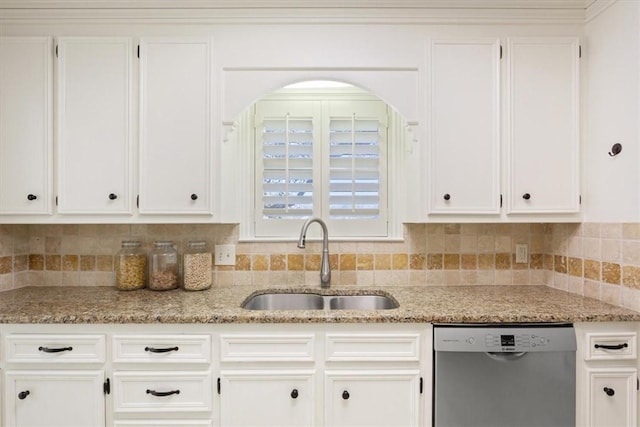 kitchen with white cabinets, stainless steel dishwasher, and sink