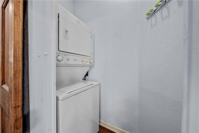 washroom with stacked washer and dryer