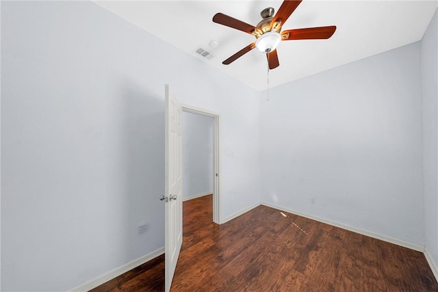 unfurnished room featuring dark hardwood / wood-style flooring and ceiling fan