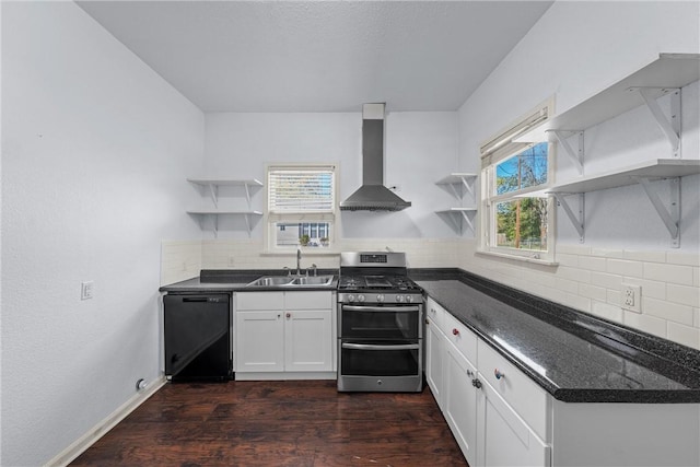 kitchen featuring wall chimney exhaust hood, sink, dishwasher, dark hardwood / wood-style floors, and stainless steel range with gas cooktop