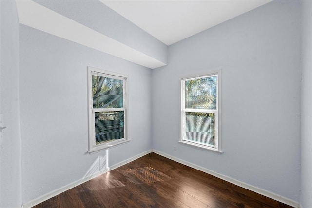 spare room featuring dark hardwood / wood-style flooring