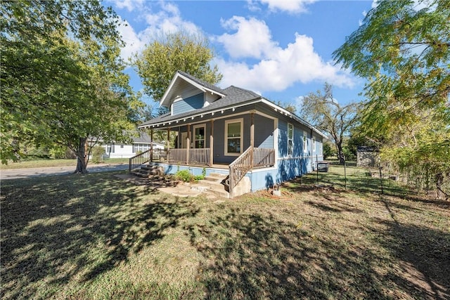 exterior space featuring a porch and a front yard