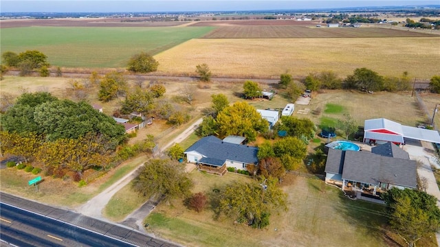 birds eye view of property with a rural view