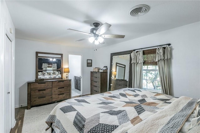 bedroom with ceiling fan and light hardwood / wood-style floors