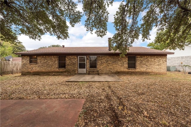 back of property featuring a patio area and central AC